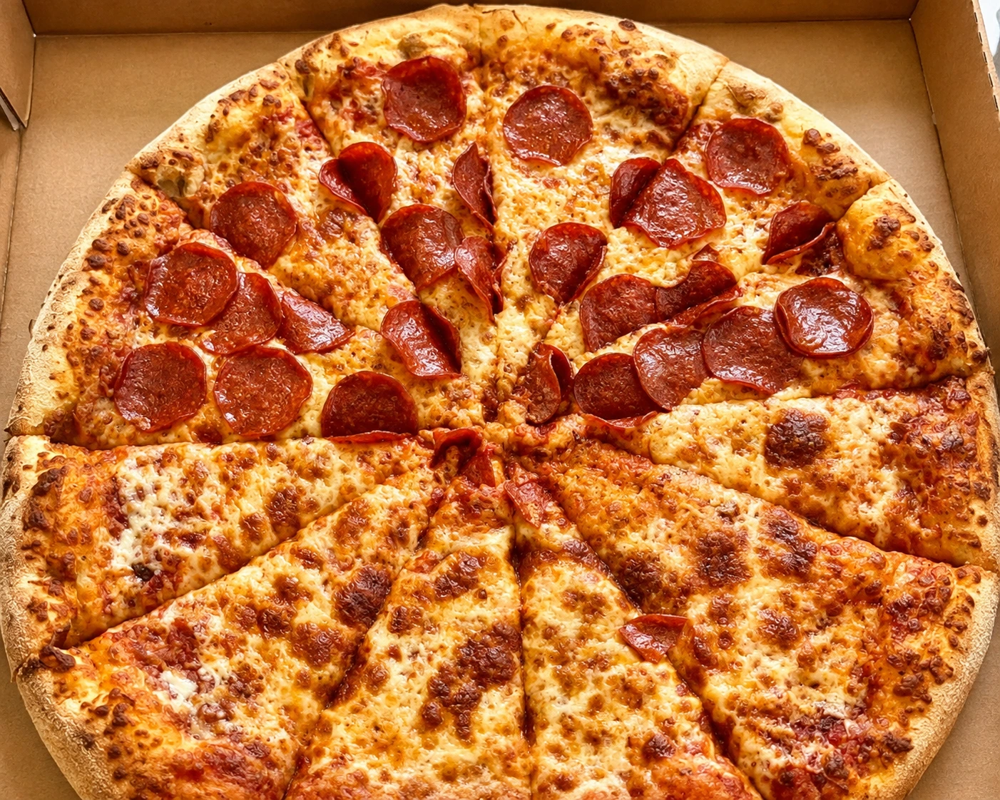 Pizza slice with garlic dipping sauce at Ancaster Pizza